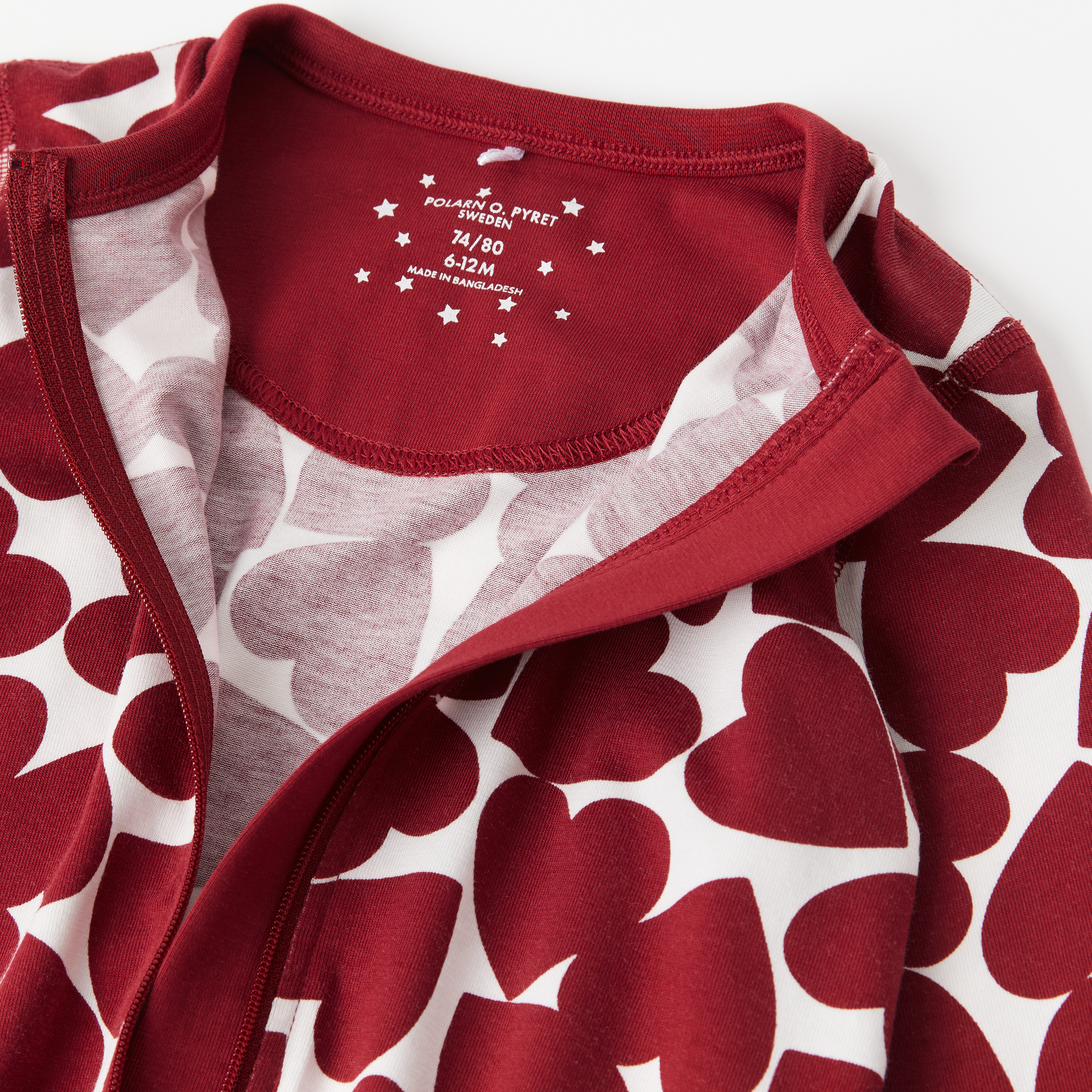 Polarn O. Pyret Pyjamasoverall med hjärtan baby röd