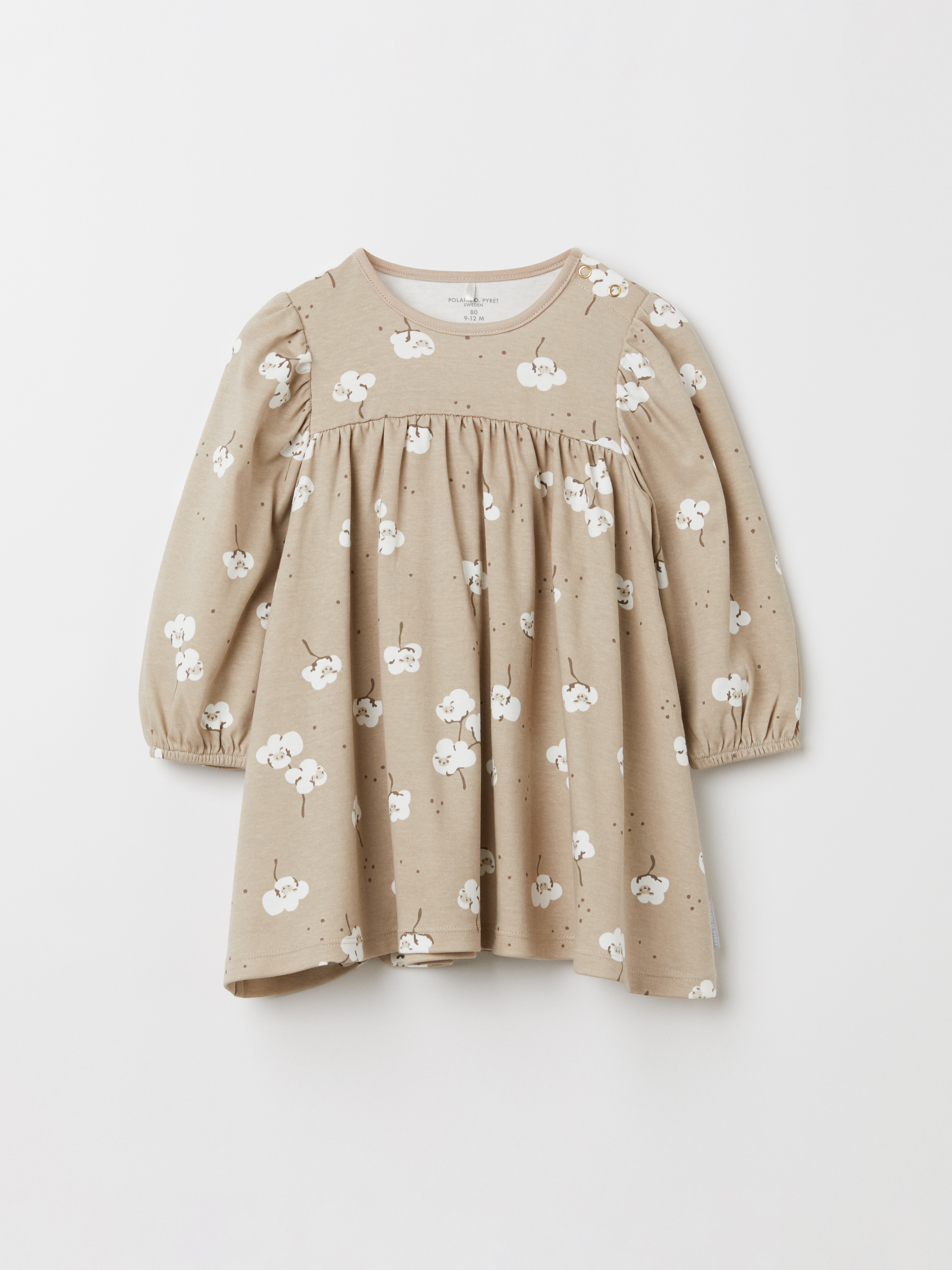 Läs mer om Klänning med bomullsblommor baby beige