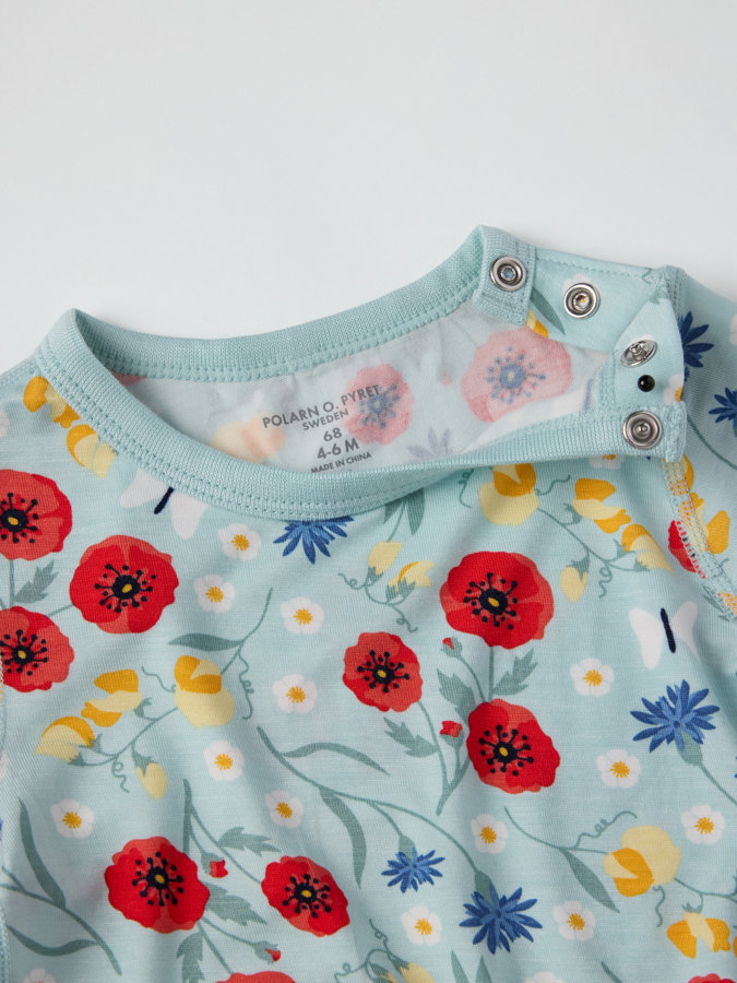 Kortärmad body blommig Kortärmad body blommig