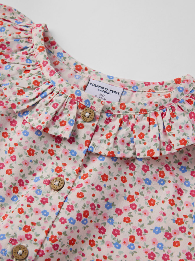 Långärmad body blommig Långärmad body blommig