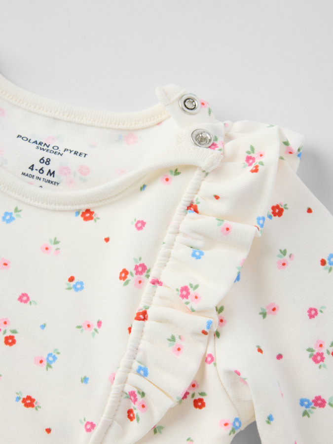 Långärmad body blommig