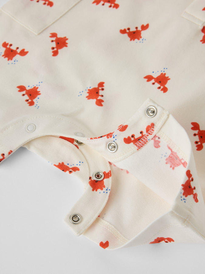 Kortärmad jumpsuit krabbor