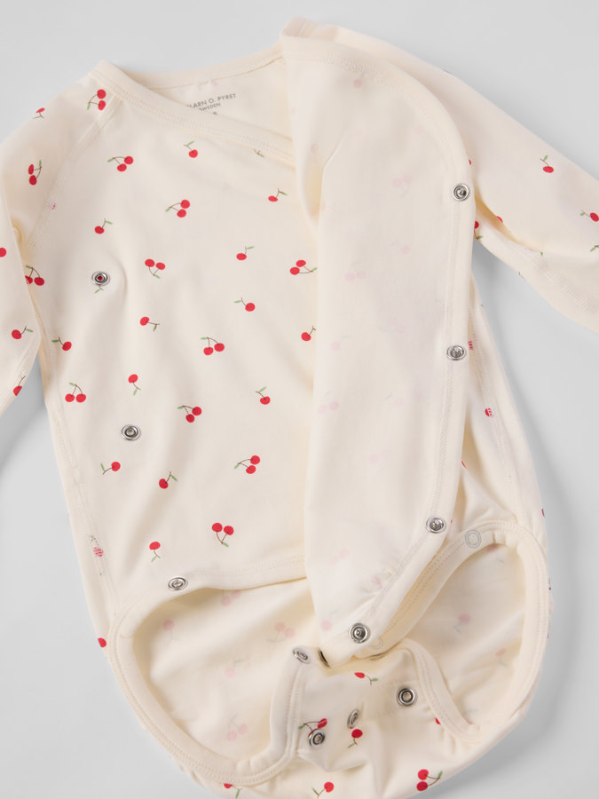 Förlängningsbar omlottbody körsbär